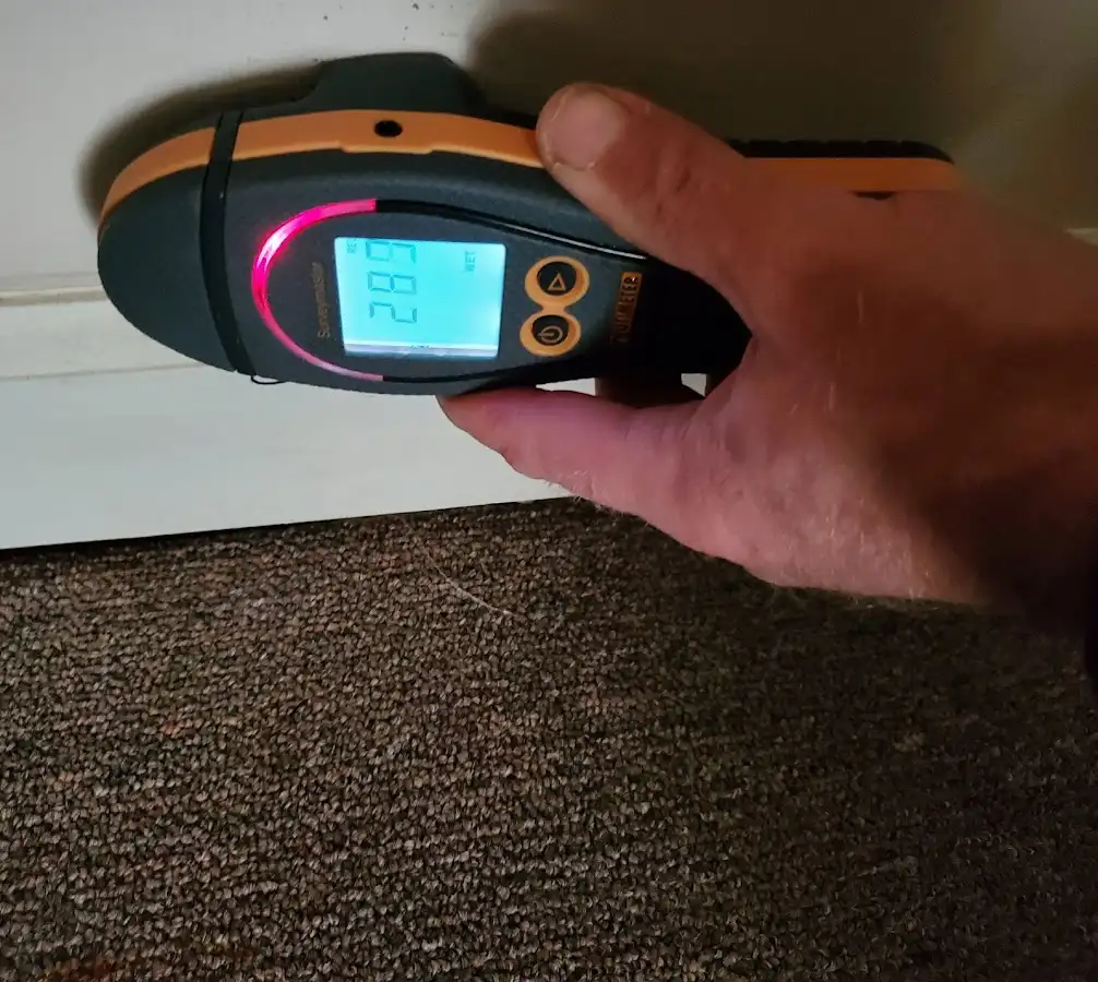 Moisture detection at baseboard during Storm Damage Restoration in Galesburg
